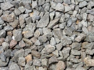 Chipped Stones beside Rail Tracks